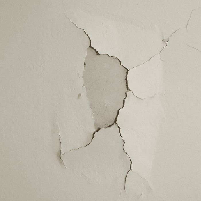 Before view of a damaged or patched wall.